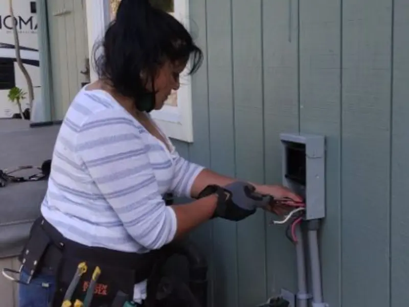 Licensed electrician wiring an exterior subpanel in Grandwood Park