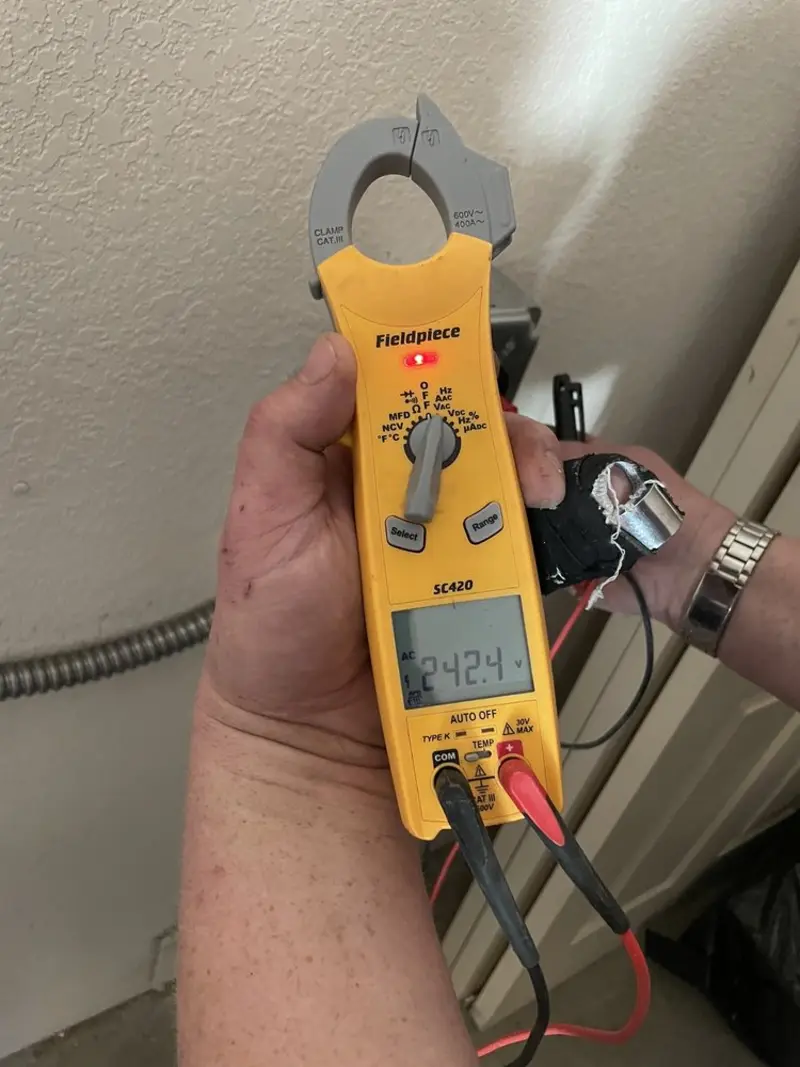 Voltage testing with clamp meter during Recessed Lighting Installation in Grandwood Park